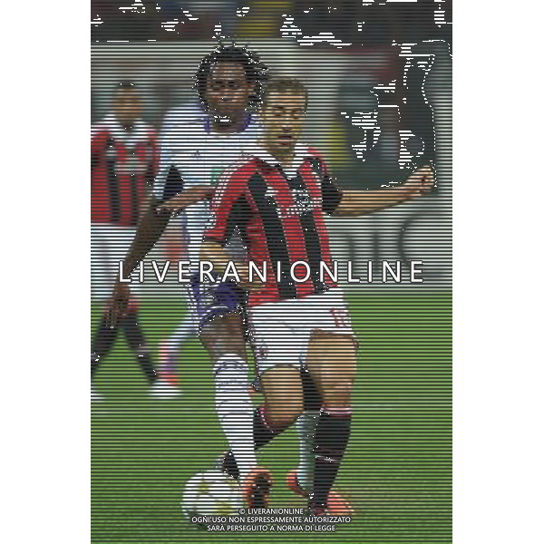 UEFA Champions League - 1Á giornata fase a gironi Gruppo C Milano 18-09-2012 Milan - Anderlecht nella foto: Mathieu Flamini (Milan) e dietro Kanu (Anderlecht) foto Roberto Garavaglia - ag. Aldo Liverani sas