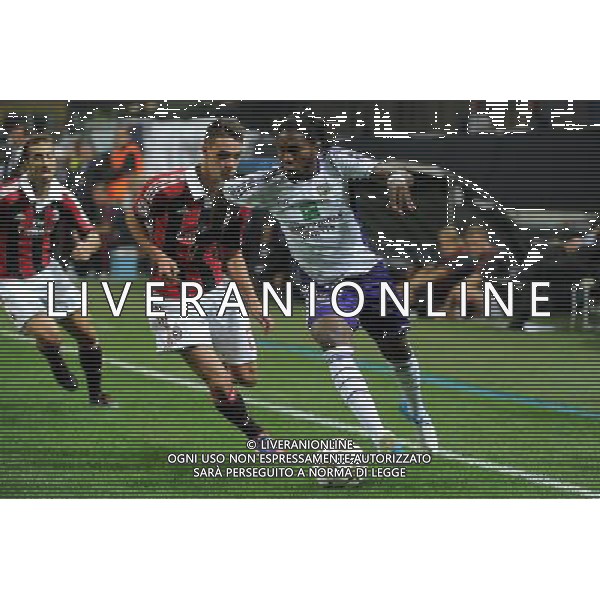 UEFA Champions League - 1Á giornata fase a gironi Gruppo C Milano 18-09-2012 Milan - Anderlecht nella foto: Dieudonne Mbokani (Anderlecht) e sulla SX Matteo De Sciglio (Milan) foto Roberto Garavaglia - ag. Aldo Liverani sas