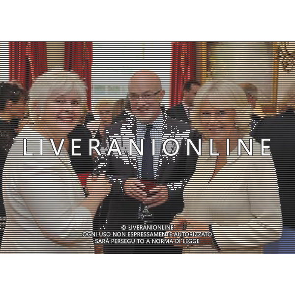 The Duchess of Cornwall with Verity Haines and David McCullough of the WRVS, during a reception for celebrities and volunteers of the Diamond Champions volunteers organised by the Women\'s Royal Voluntary Service (WRVS), at Clarence House in central London. Â©photoshot/Agenzia Aldo Liverani ITALY ONLY REALI INGLESI: il principe Carlo d\' Inghilterra con la consorte Camilla Duchessa di Cornovaglia durante le loro visite ufficiali