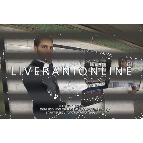 Rabbi Ari Hart, left, and his Muslim friend Anan Farooqui, right, protest an advertisement in the subway in New York supports Israel and promotes defeating Jihad, referring to Jihadists as savages, seen in the Times Square subway station on Monday, September 24, 2012. The controversial poster is from the American Freedom Defense Initiative, a group run by Pamela Geller who also runs the Stop Islamization of America group. Â©photoshot/Agenzia Aldo Liverani ITALY ONLY vedute citta\' di New York