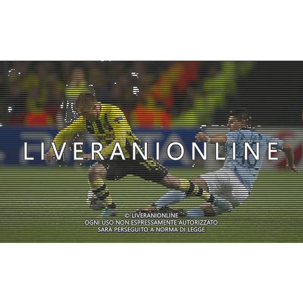 Borussia Dortmund\'s Jakub Blaszczykowski is tackled by Manchester City\'s Sergio Aguero Football - UEFA Champions League Group D - Manchester City v Borussia Dortmund - Wednesday 3rd October 2012 - Etihad Stadium - Manchester å© CameraSport - 43 Linden Ave. Countesthorpe. Leicester. England. LE8 5PG - Tel: +44 (0) 116 277 4147 - admin@camerasport.com - www.camerasport.com AG ALDO LIVERANI S A S ONLY ITALY