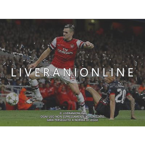 Arsenal\'s Carl Jenkinson battles with Olympiakos\' Jose Holebas Football - UEFA Champions League Group B - Arsenal v Olympiakos FC - Wednesday 3rd October 2012 - Emirates Stadium - London © CameraSport - 43 Linden Ave. Countesthorpe. Leicester. England. LE8 5PG - Tel: +44 (0) 116 277 4147 - admin@camerasport.com - www.camerasport.com AG ALDO LIVERANI S A S ONLY ITALY