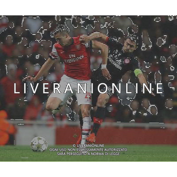 Arsenal\'s Carl Jenkinson battles with Olympiakos\' Giannis Maniatis Football - UEFA Champions League Group B - Arsenal v Olympiakos FC - Wednesday 3rd October 2012 - Emirates Stadium - London © CameraSport - 43 Linden Ave. Countesthorpe. Leicester. England. LE8 5PG - Tel: +44 (0) 116 277 4147 - admin@camerasport.com - www.camerasport.com AG ALDO LIVERANI S A S ONLY ITALY
