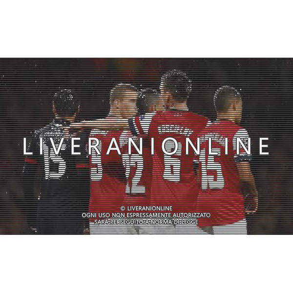 (121004) -- LONDON, Oct. 4, 2012 () -- Lukas Podolski (2nd, L) of Arsenal reacts during the UEFA Champions League Group B match between Arsenal FC and Olympiacos FC at the Emirates Stadium in London, Britain on Oct. 3, 2012. Arsenal won 3-1. (/Wang Lili) ©PHOTOSHOT/AGENZIA ALDO LIVERANI SAS - ITALY ONLY - EDITORIAL USE ONLY