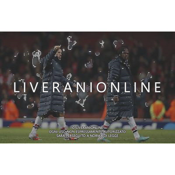 (121004) -- LONDON, Oct. 4, 2012 () -- Lukas Podolski (L) and Gervinho of Arsenal greet the spectators after the UEFA Champions League Group B match between Arsenal FC and Olympiacos FC at the Emirates Stadium in London, Britain on Oct. 3, 2012. Arsenal won 3-1. (/Wang Lili) ©PHOTOSHOT/AGENZIA ALDO LIVERANI SAS - ITALY ONLY - EDITORIAL USE ONLY