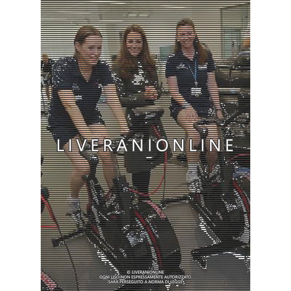 BURTON-UPON-TRENT, ENGLAND - OCTOBER 09: Catherine, Duchess of Cambridge meet ladies on training bikes in the new gym during the official launch of The Football Association\'s National Football Centre at St George\'s Park on October 9, 2012 in Burton-upon-Trent, England. ©photoshot/AGENZIA ALDO LIVERANI SAS - ITALY ONLY - REALI INGLESI: Il principe William e la moglie Kate Middleton alla presentazione ufficiale di The Football Association National Football Centre al Parco di San Giorgio a Burton upon Trent, Inghilterra 09/10/2012. 
