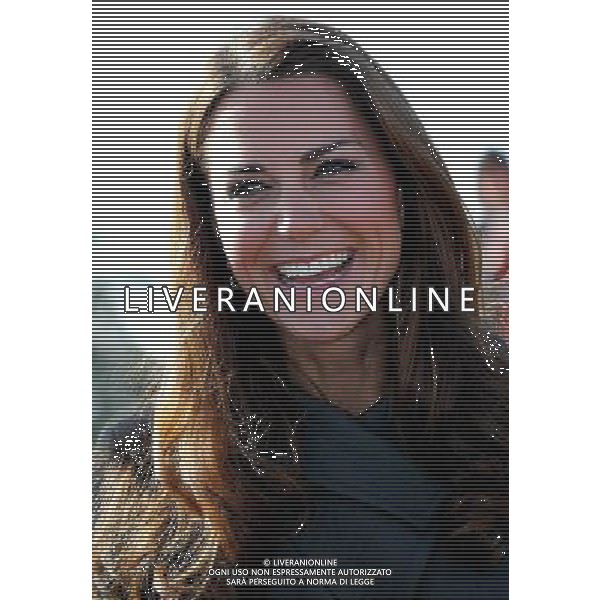 BURTON-UPON-TRENT, ENGLAND - OCTOBER 09: Catherine, Duchess of Cambridge smiles during the official launch of The Football Association\'s National Football Centre at St George\'s Park on October 9, 2012 in Burton-upon-Trent, England. ©photoshot/AGENZIA ALDO LIVERANI SAS - ITALY ONLY - REALI INGLESI: Il principe William e la moglie Kate Middleton alla presentazione ufficiale di The Football Association National Football Centre al Parco di San Giorgio a Burton upon Trent, Inghilterra 09/10/2012. 