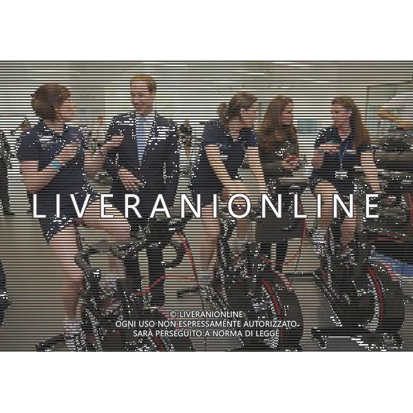 BURTON-UPON-TRENT, ENGLAND - OCTOBER 09: Prince William, Duke of Cambridge and Catherine, Duchess of Cambridge meet ladies on training bikes in the new gym during the official launch of The Football Association\'s National Football Centre at St George\'s Park on October 9, 2012 in Burton-upon-Trent, England. ©photoshot/AGENZIA ALDO LIVERANI SAS - ITALY ONLY - REALI INGLESI: Il principe William e la moglie Kate Middleton alla presentazione ufficiale di The Football Association National Football Centre al Parco di San Giorgio a Burton upon Trent, Inghilterra 09/10/2012. 