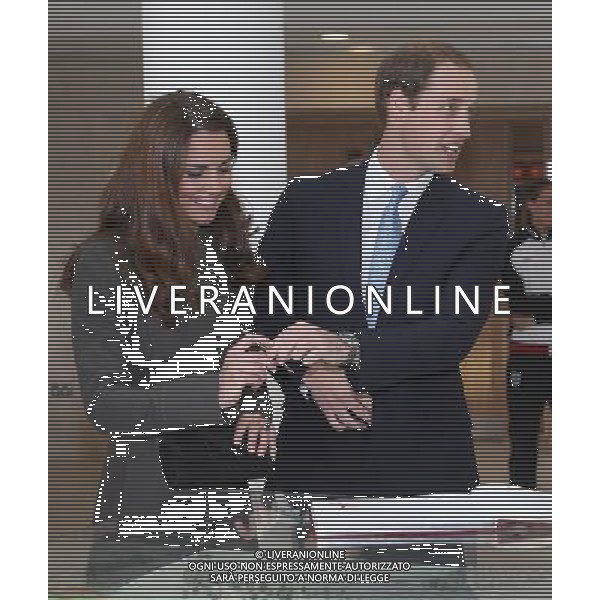 BURTON-UPON-TRENT, ENGLAND - OCTOBER 09: Prince William, Duke of Cambridge and Catherine, Duchess of Cambridge sign the visitors book during the official launch of The Football Association\'s National Football Centre at St George\'s Park on October 9, 2012 in Burton-upon-Trent, England. ©photoshot/AGENZIA ALDO LIVERANI SAS - ITALY ONLY - REALI INGLESI: Il principe William e la moglie Kate Middleton alla presentazione ufficiale di The Football Association National Football Centre al Parco di San Giorgio a Burton upon Trent, Inghilterra 09/10/2012. 