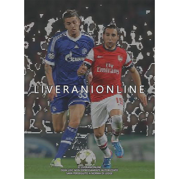 Arsenal\'s Santi Cazorla in action during todays match Schalke\'s Roman Neustadter Football - UEFA Champions League Group B - Arsenal v Schalke - Wednesday 24th October 2012 - Emirates Stadium - London © CameraSport - 43 Linden Ave. Countesthorpe. Leicester. England. LE8 5PG - Tel: +44 (0) 116 277 4147 - admin@camerasport.com - www.camerasport.com AG ALDO LIVERANI S A S ONLY ITALY