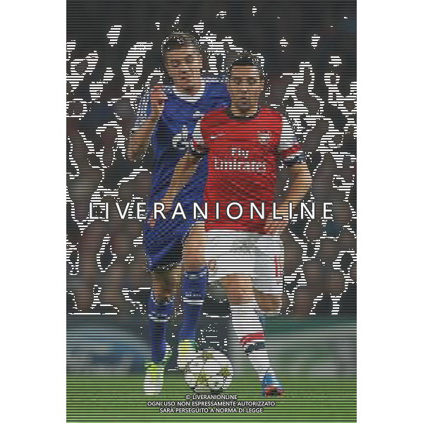 Arsenal\'s Santi Cazorla in action during todays match Schalke\'s Roman Neustadter Football - UEFA Champions League Group B - Arsenal v Schalke - Wednesday 24th October 2012 - Emirates Stadium - London © CameraSport - 43 Linden Ave. Countesthorpe. Leicester. England. LE8 5PG - Tel: +44 (0) 116 277 4147 - admin@camerasport.com - www.camerasport.com AG ALDO LIVERANI S A S ONLY ITALY
