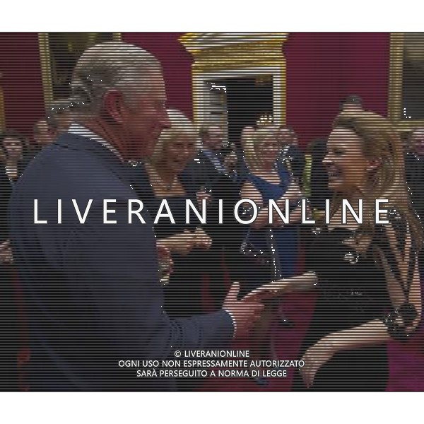 Australian pop singer, Kylie Minogue (R), meets Britain\'s Prince Charles and his wife Camilla, Duchess of Cornwall at St James\'s Palace in central London on October 24, 2012, during a reception for prominent Papua New Guineans, Australians and New Zealanders living in the UK ahead of their tour Papua New Guinea, Australia and New Zealand. ©photohsot/AGENZIA ALDO LIVERANI SAS - ITALY ONLY - REALI INGLESI: Il principe Carlo d\'inghilterra e la moglie Camilla, duchessa di Cornovaglia durante un ricevimento per le comunita\' Papua Nuova Guinea, australiana e neozelandese che vivono nel Regno Unito, presso il Palazzo San Giacomo nel centro di Londra il 24 ottobre 2012