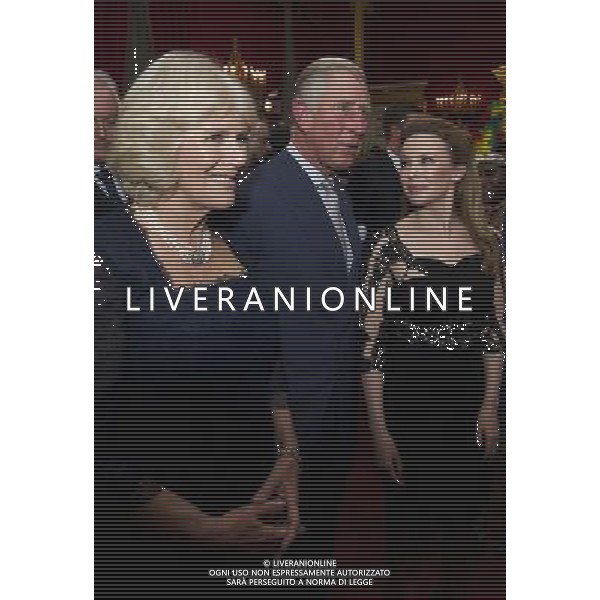 Australian pop singer, Kylie Minogue (R), meets Britain\'s Prince Charles (C) and his wife Camilla, Duchess of Cornwall at St James\'s Palace in central London on October 24, 2012, during a reception for prominent Papua New Guineans, Australians and New Zealanders living in the UK ahead of their tour Papua New Guinea, Australia and New Zealand. ©photohsot/AGENZIA ALDO LIVERANI SAS - ITALY ONLY - REALI INGLESI: Il principe Carlo d\'inghilterra e la moglie Camilla, duchessa di Cornovaglia durante un ricevimento per le comunita\' Papua Nuova Guinea, australiana e neozelandese che vivono nel Regno Unito, presso il Palazzo San Giacomo nel centro di Londra il 24 ottobre 2012