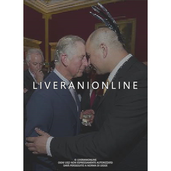 Britain\'s Prince Charles is greeted with a traditional Maori hongi by Bruce Simpson from the Ngati Ranana London Maori Club, at St James\'s Palace in central London on October 24, 2012, during a reception for prominent Papua New Guineans, Australians and New Zealanders living in the UK ahead of their tour Papua New Guinea, Australia and New Zealand. ©photohsot/AGENZIA ALDO LIVERANI SAS - ITALY ONLY - REALI INGLESI: Il principe Carlo d\'inghilterra e la moglie Camilla, duchessa di Cornovaglia durante un ricevimento per le comunita\' Papua Nuova Guinea, australiana e neozelandese che vivono nel Regno Unito, presso il Palazzo San Giacomo nel centro di Londra il 24 ottobre 2012