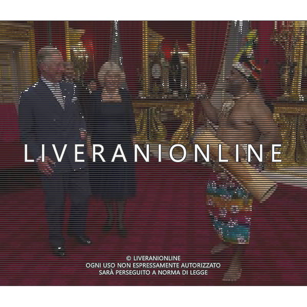 A traditional Papua New Guinean drummer performs for Britain\'s Prince Charles and his wife Camilla, Duchess of Cornwall at St James\'s Palace in central London on October 24, 2012, during a reception for prominent Papua New Guineans, Australians and New Zealanders living in the UK ahead of their tour Papua New Guinea, Australia and New Zealand. ©photohsot/AGENZIA ALDO LIVERANI SAS - ITALY ONLY - REALI INGLESI: Il principe Carlo d\'inghilterra e la moglie Camilla, duchessa di Cornovaglia durante un ricevimento per le comunita\' Papua Nuova Guinea, australiana e neozelandese che vivono nel Regno Unito, presso il Palazzo San Giacomo nel centro di Londra il 24 ottobre 2012