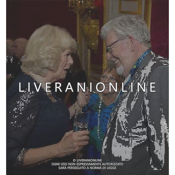 Britain\'s Camilla, Duchess of Cornwall, meets Australian artist, Rolf Harris and his wife Alwen Hughes, at St James\'s Palace in central London on October 24, 2012, during a reception for prominent Papua New Guineans, Australians and New Zealanders living in the UK ahead of their tour Papua New Guinea, Australia and New Zealand. ©photohsot/AGENZIA ALDO LIVERANI SAS - ITALY ONLY - REALI INGLESI: Il principe Carlo d\'inghilterra e la moglie Camilla, duchessa di Cornovaglia durante un ricevimento per le comunita\' Papua Nuova Guinea, australiana e neozelandese che vivono nel Regno Unito, presso il Palazzo San Giacomo nel centro di Londra il 24 ottobre 2012