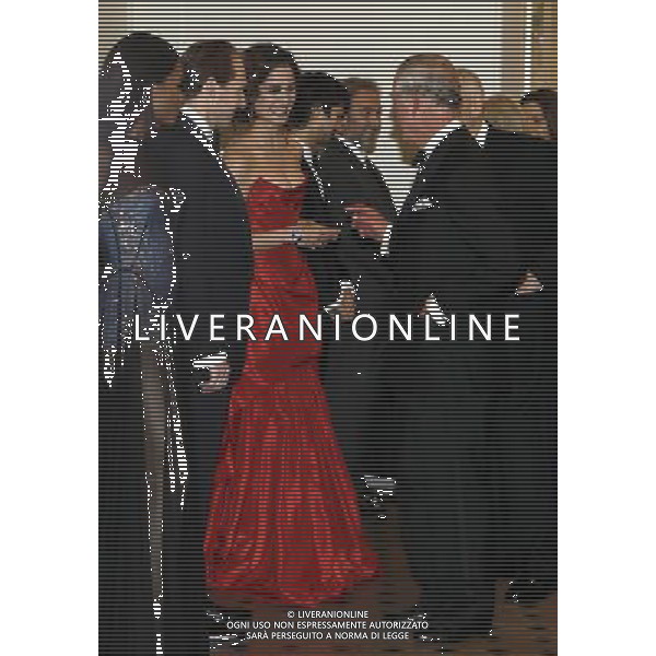 Britain\'s Prince of Wales, right, meets Bond girl Berenice Marlohe as he arrives to attend the world premiere of the James Bond film, \'Skyfall\', at the Royal Albert Hall, in London Tuesday, Oct. 23, 2012. (AP Photo/Kirsty Wigglesworth, Pool) ©photoshot/AGENZIA ALDO LIVERANI SAS - ITALY ONLY - REALI INGLESI: Il principe Carlo d\'inghilterra e la moglie Camilla alla prima mondiale del film di James Bond, \'Skyfall\', alla Royal Albert Hall di Londra Marted“ 23 Ottobre 2012.