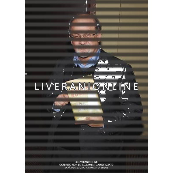 26 October 2012 - Hamilton, Ontario, Canada. British author Salman Rushdie poses in the green room with a copy of his book \'Joseph Anton: A Memoir\' during an apperance at the Lincoln Alexander Centre. Photo Credit: Brent Perniac/AdMedia AG ALDO LIVERANI S A S ONLY ITALY