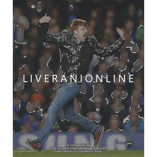 (121101) -- LONDON, Nov. 1, 2012 () -- A pitch invader runs on the pitch during the Capital One Cup Fourth Round match between Chelsea and Manchester United in London, Britain, on Oct. 31, 2012. Manchester United lost 4-5. (/Wang Lili) FOR EDITORIAL USE ONLY. NOT FOR SALE FOR MARKETING OR ADVERTISING CAMPAIGNS. NO USE WITH UNAUTHORIZED AUDIO, VIDEO, DATA, FIXTURE LISTS, CLUB/LEAGUE LOGOS OR \'LIVE\' SERVICES. ONLINE IN-MATCH USE LIMITED TO 45 IMAGES, NO VIDEO EMULATION. NO USE IN BETTING, GAMES OR SINGLE CLUB/LEAGUE/PLAYER PUBLICATIONS. AG ALDO LIVERANI S A S ONLY ITALY