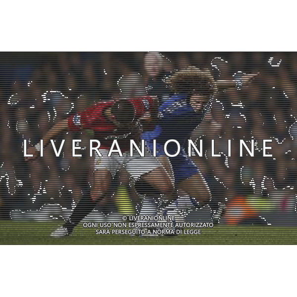 (121101) -- LONDON, Nov. 1, 2012 () -- David Luiz (R) of Chelsea vies with Javier Hernandez of Manchester United during the Capital One Cup Fourth Round match between Chelsea and Manchester United in London, Britain, on Oct. 31, 2012. Chelsea won 5-4. (/Wang Lili) FOR EDITORIAL USE ONLY. NOT FOR SALE FOR MARKETING OR ADVERTISING CAMPAIGNS. NO USE WITH UNAUTHORIZED AUDIO, VIDEO, DATA, FIXTURE LISTS, CLUB/LEAGUE LOGOS OR \'LIVE\' SERVICES. ONLINE IN-MATCH USE LIMITED TO 45 IMAGES, NO VIDEO EMULATION. NO USE IN BETTING, GAMES OR SINGLE CLUB/LEAGUE/PLAYER PUBLICATIONS. AG ALDO LIVERANI S A S ONLY ITALY