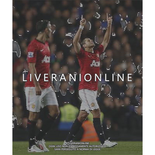 (121101) -- LONDON, Nov. 1, 2012 () -- Javier Hernandez (R) of Manchester United celebrates scoring during the Capital One Cup Fourth Round match between Chelsea and Manchester United in London, Britain, on Oct. 31, 2012. Manchester United lost 4-5. (/Wang Lili) FOR EDITORIAL USE ONLY. NOT FOR SALE FOR MARKETING OR ADVERTISING CAMPAIGNS. NO USE WITH UNAUTHORIZED AUDIO, VIDEO, DATA, FIXTURE LISTS, CLUB/LEAGUE LOGOS OR \'LIVE\' SERVICES. ONLINE IN-MATCH USE LIMITED TO 45 IMAGES, NO VIDEO EMULATION. NO USE IN BETTING, GAMES OR SINGLE CLUB/LEAGUE/PLAYER PUBLICATIONS. AG ALDO LIVERANI S A S ONLY ITALY