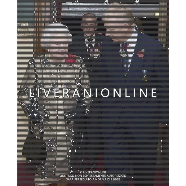Britain\'s Queen Elizabeth II, left, is greeted by the President of the Royal British Legion Vice- Admiral Peter Wilkinson, as she arrives to attend the annual Royal Festival of Remembrance, at London\'s Royal Albert Hall, Saturday Nov. 10, 2012. Prince Philip, the Duke Of Edinburgh is in the background. ©photoshot/AGENZIA ALDO LIVERANI SAS - ITALY ONLY - REALI INGLESI: la regina Elisabetta II con il marito Filippo, Duca di Edimburgo al Festival annuale Reale della Memoria, alla Royal Albert Hall, Sabato 10 novembre 2012.