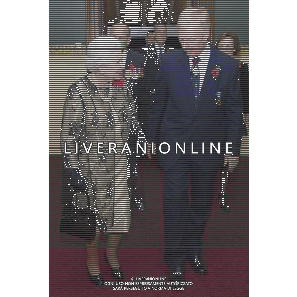 Britain\'s Queen Elizabeth II, left, is greeted by the President of the Royal British Legion Vice- Admiral Peter Wilkinson, as she arrives to attend the annual Royal Festival of Remembrance, at London\'s Royal Albert Hall, Saturday Nov. 10, 2012. ©photoshot/AGENZIA ALDO LIVERANI SAS - ITALY ONLY - REALI INGLESI: la regina Elisabetta II con il marito Filippo, Duca di Edimburgo al Festival annuale Reale della Memoria, alla Royal Albert Hall, Sabato 10 novembre 2012.