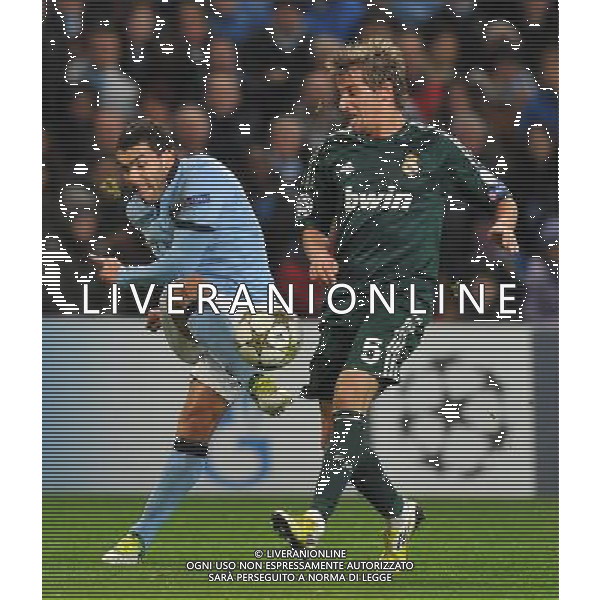Manchester City\'s Carlos Tevez shoots past Real Madrid\'s Fabio Coentrao ..Football - UEFA Champions League Group D - Manchester City v Real Madrid - Wednesday 21st November 2012 - Etihad Stadium - Manchester.. AG ALDO LIVERANI S A S ONLY ITALY