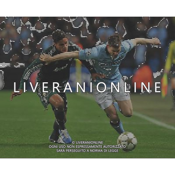 Manchester City\'s James Milner and Real Madrid\'s Raphael Varane battle for the ball Football - UEFA Champions League Group D - Manchester City v Real Madrid - Wednesday 21st November 2012 - Etihad Stadium - Manchester å© CameraSport - 43 Linden Ave. Countesthorpe. Leicester. England. LE8 5PG - Tel: +44 (0) 116 277 4147 - admin@camerasport.com - www.camerasport.com AG ALDO LIVERANI S A S ONLY ITALY