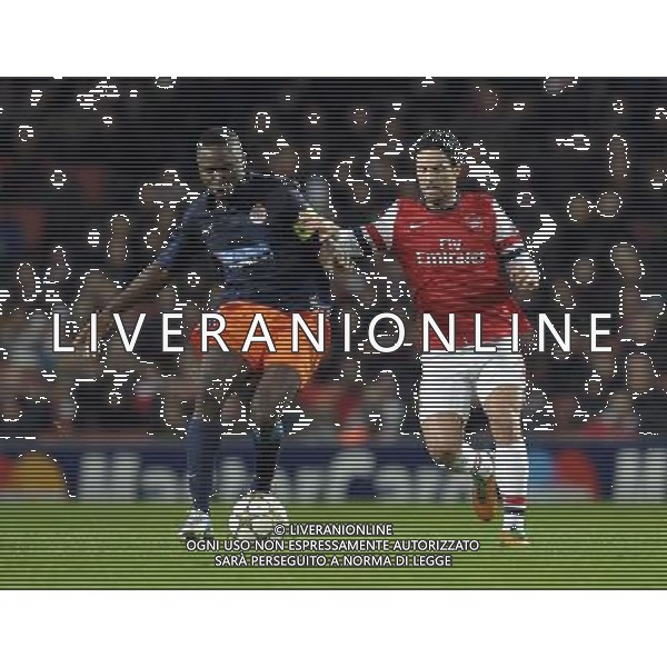 Emirates Stadium Arsenal v Montpelier League 17/11/2012 Mikel Arteta (Arsenal) Mapou Yanga-Mbiwa(Montpelier) Photo:Roger Parker Fotosports International AG ALDO LIVERANI S A S ONLY ITALY