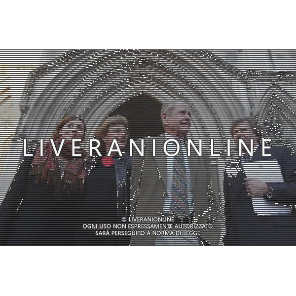 Sarah Hermitage (2nd L) her husband Stewart Middleton (2nd R) and their solicitor Andrew Stephenson (R) pose for a photograph out side The Royal Courts of Justice in London Britain 30 November 201. Reginald Mengi claims that she has libeled him by claiming that he undertook a campaign of harrassment, that resulted in Hermitage having to leave her farm in Tanzania. ©PHOTOSHOT/Agenzia Aldo Liverani Sas - ITALY ONLY - EDITORIAL USE ONLY