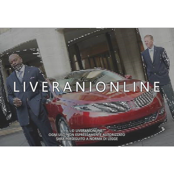 NEW YORK, NY - DECEMBER 03: Ford Motor Company President and CEO Alan Mulally stands with Emmitt Smith as he speaks to the press during a media launch for the new Lincoln Motor Company MKZ sedan in front of Avery Fisher Hall, Lincoln Center Plaza on December 3, 2012 in New York City. Ford is renaming its Lincoln division as the Lincoln Motor Co., as it looks to revive the luxury brand. The MKZ will arrive at dealerships later this month and will start at $35,925. The MKZ is the first of seven new Lincoln\'s that will go on sale by 2015. /AGENZIA ALDO LIVERANI SAS/ITALY ONLY - EDITORIAL USE ONLY