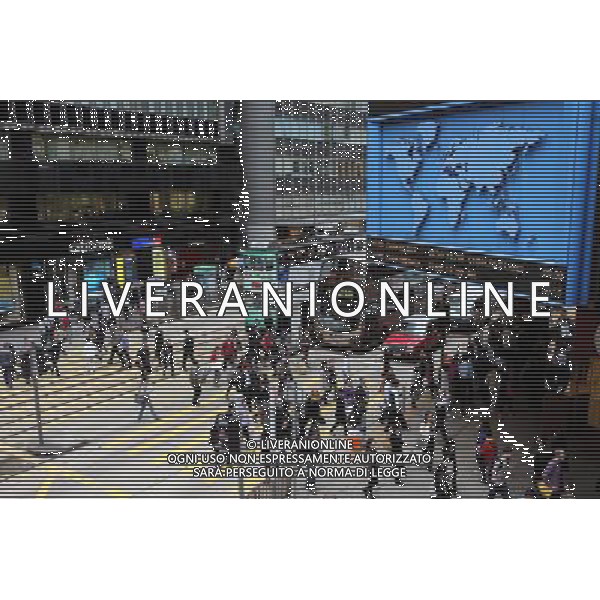 (121205) -- HONG KONG, Dec. 5, 2012 () -- Pedestrians walk across a zebra marking near the International Financial Center (IMF) in the central district of Hong Kong, South China, Nov. 29, 2012. Hong Kong ranks first in the ranking list of China city comprehensive competitiveness released by China Institute of City Competitiveness (CICC) on Wednesday. (/Li Peng) (yxb) ©photoshot/AGENZIA ALDO LIVERANI SAS - ITALY ONLY - La citta\' di Hong Kong e\' al primo posto nella graduatoria della competitivita\' delle citta\' cinesi - Cina, 5 dicembre 2012