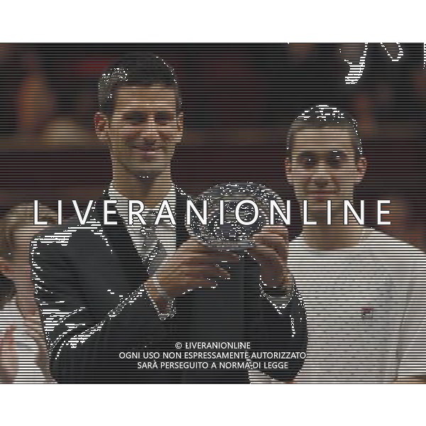 Serbian tennis player Novak Djokovic with the \'Centrepoint Premier Award for Contribution to the Lives of Youth Across the World\' in recognition of his Novak Djokavic Foundation at the Winter Whites Gala in aid of the homeless charity Centrepoint at the Royal Hall in London December 8, 2012. ©photoshot/AGENZIA ALDO LIVERANI SAS - ITALY ONLY - REALI INGLESI: Il principe William durante il Gala Bianco Inverno per beneficenza e carita\' ai senzatetto presso la Sala Reale di Londra 8 dicembre 2012 