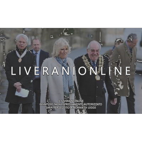 The Duchess of Cornwall walks with Mayor Ray Sanderson during a visit to see flood damage in Malmesbury, Wiltshire. ©photoshot/AGENZIA ALDO LIVERANI SAS - ITALY ONLY - REALI INGLESI: Camilla Duchessa di Cornovaglia in visita alle famiglie vittime dei danni provocati dalle inondazioni a Malmesbury, Wiltshire 8 dicembre 2012