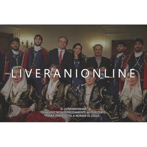 (121224) -- ATHENS, Dec. 24, 2012 () -- Greek Prime Minister Antonis Samaras (3rd L, rear) poses for photos with members of cultural clubs, dressed in traditional costumes, at Maximos Mansion, central Athens, Greece, Dec. 24, 2012. On Christmas Eve, traditional carols are sung throughout Greece, giving a tone of optimism in a country struck by the economic crisis. (/Marios Lolos) (zf) ©photoshot/Agenzia Aldo Liverani Sas - ITALY ONLY - La vigilia di Natale, canti vestiti in costumi tradizionali in tutta la Grecia, Atene 24 dicembre, 2012.