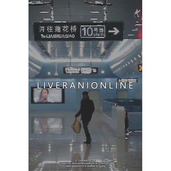 (121230) -- BEIJING, Dec. 30, 2012 () -- A passenger is seen at the Gongzhufen Station of the newly-opened Phase II of Subway Line 10 in Beijing, capital of China, Dec. 30, 2012. Beijing put four new subway lines into operation on Sunday, increasing its daily passenger capacity by about 1.5 million. The new lines have brought the number of subway lines in Beijing to 16, raising the capital city\'s total subway transport capacity to over 9 million passengers per day, said the Beijing Metro Company. (/Chen Weisong) (lmm) ©Photoshot/AGENZIA ALDO LIVERANI SAS-ITALY ONLY - EDITORIAL USE ONLY