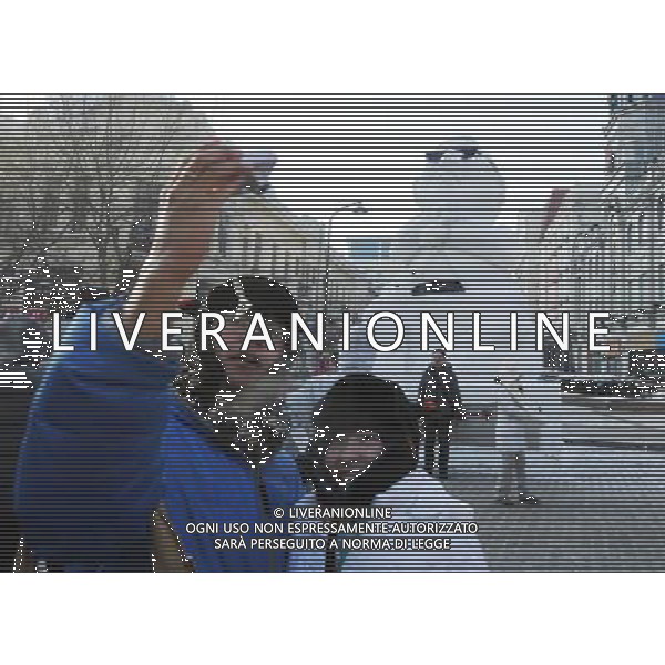 (130102) -- HARBIN, Jan. 2, 2013 () -- Tourists pose for photo in front of a snow sculpture of South Korean rapper Psy in Harbin, capital of northeast China\'s Heilongjiang Province, Jan. 2, 2013. Psy\'s music video of \'Gangnam Style,\' featuring the horse-riding dance, became a global sensation this year. (/Wang Jianwei) (mp) ©Photoshot-ITALY ONLY - EDITORIAL USE ONLY/AGENZIA ALDO LIVERANI SAS
