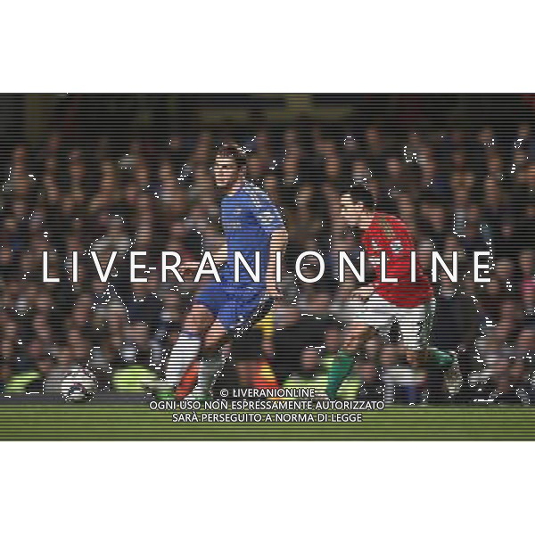 Chelsea\'s Branislav Ivanovic passes the ball under pressure from Swansea City\'s Leon Britton Football - Football - Capital One Cup Semi-Final - Chelsea v Swansea City - Wednesday 9th January 2013 - Stamford Bridge - London © CameraSport - 43 Linden Ave. Countesthorpe. Leicester. England. LE8 5PG - Tel: +44 (0) 116 277 4147 - admin@camerasport.com - www.camerasport.com AG ALDO LIVERANI S A S ONLY ITALY