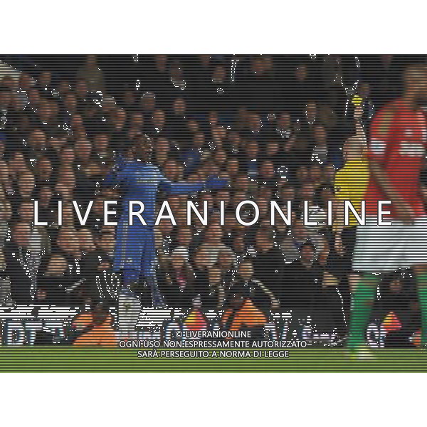 Demba Ba is given the yellow card by Referee Anthony Taylor for diving Chelsea 2012/13 Chelsea V Swansea City (0-2) 09/01/13 The Capital One Cup Semi Final 1st Leg Photo: Robin Parker Fotosports International ©photoshot/AGENZIA ALDO LIVERANI SAS - ITALY ONLY - EDITORIAL USE ONLY