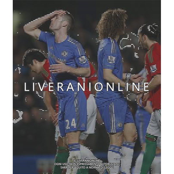 (130110) -- LONDON, Jan. 10, 2013 () -- Gary Cahill of Chelsea reacts after missing a goal during the English League Cup (Capital One Cup) semifinal first leg between Chelsea and Swansea at Stamford Bridge in London, Britain, on Jan. 9, 2013. Chelsea lost 0-2. (/Wang Lili) FOR EDITORIAL USE ONLY. NOT FOR SALE FOR MARKETING OR ADVERTISING CAMPAIGNS. NO USE WITH UNAUTHORIZED AUDIO, VIDEO, DATA, FIXTURE LISTS, CLUB/LEAGUE LOGOS OR \'LIVE\' SERVICES. ONLINE IN-MATCH USE LIMITED TO 45 IMAGES, NO VIDEO EMULATION. NO USE IN BETTING, GAMES OR SINGLE CLUB/LEAGUE/PLAYER PUBLICATIONS. AG ALDO LIVERANI S A S ONLY ITALY