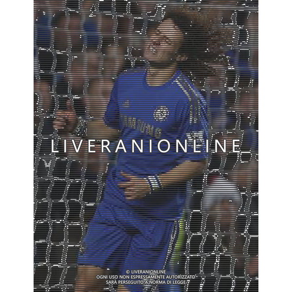 (130110) -- LONDON, Jan. 10, 2013 () -- David Luiz of Chelsea reacts after missing a goal during the English League Cup (Capital One Cup) semifinal first leg between Chelsea and Swansea at Stamford Bridge in London, Britain, on Jan. 9, 2013. Chelsea lost 0-2. (/Wang Lili) FOR EDITORIAL USE ONLY. NOT FOR SALE FOR MARKETING OR ADVERTISING CAMPAIGNS. NO USE WITH UNAUTHORIZED AUDIO, VIDEO, DATA, FIXTURE LISTS, CLUB/LEAGUE LOGOS OR \'LIVE\' SERVICES. ONLINE IN-MATCH USE LIMITED TO 45 IMAGES, NO VIDEO EMULATION. NO USE IN BETTING, GAMES OR SINGLE CLUB/LEAGUE/PLAYER PUBLICATIONS. AG ALDO LIVERANI S A S ONLY ITALY