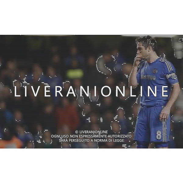 (130110) -- LONDON, Jan. 10, 2013 () -- Frank Lampard of Chelsea looks dejected after Swansea scored the second goal during the English League Cup (Capital One Cup) semifinal first leg between Chelsea and Swansea at Stamford Bridge in London, Britain, on Jan. 9, 2013. Chelsea lost 0-2. (/Wang Lili) FOR EDITORIAL USE ONLY. NOT FOR SALE FOR MARKETING OR ADVERTISING CAMPAIGNS. NO USE WITH UNAUTHORIZED AUDIO, VIDEO, DATA, FIXTURE LISTS, CLUB/LEAGUE LOGOS OR \'LIVE\' SERVICES. ONLINE IN-MATCH USE LIMITED TO 45 IMAGES, NO VIDEO EMULATION. NO USE IN BETTING, GAMES OR SINGLE CLUB/LEAGUE/PLAYER PUBLICATIONS. AG ALDO LIVERANI S A S ONLY ITALY