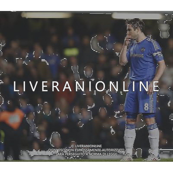 (130110) -- LONDON, Jan. 10, 2013 () -- Frank Lampard of Chelsea looks dejected after Swansea scored the second goal during the English League Cup (Capital One Cup) semifinal first leg between Chelsea and Swansea at Stamford Bridge in London, Britain, on Jan. 9, 2013. Chelsea lost 0-2. (/Wang Lili) FOR EDITORIAL USE ONLY. NOT FOR SALE FOR MARKETING OR ADVERTISING CAMPAIGNS. NO USE WITH UNAUTHORIZED AUDIO, VIDEO, DATA, FIXTURE LISTS, CLUB/LEAGUE LOGOS OR \'LIVE\' SERVICES. ONLINE IN-MATCH USE LIMITED TO 45 IMAGES, NO VIDEO EMULATION. NO USE IN BETTING, GAMES OR SINGLE CLUB/LEAGUE/PLAYER PUBLICATIONS. AG ALDO LIVERANI S A S ONLY ITALY