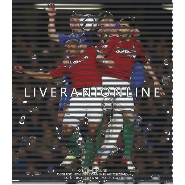 (130110) -- LONDON, Jan. 10, 2013 () -- Branislav Ivanovic(L Back) and Gary Cahill (R Back) of Chelsea head with Ashley Williams (L Front) and Chico Flores (R Front) of Swansea during the English League Cup (Capital One Cup) semifinal first leg between Chelsea and Swansea at Stamford Bridge in London, Britain, on Jan. 9, 2013. Chelsea lost 0-2. (/Wang Lili) FOR EDITORIAL USE ONLY. NOT FOR SALE FOR MARKETING OR ADVERTISING CAMPAIGNS. NO USE WITH UNAUTHORIZED AUDIO, VIDEO, DATA, FIXTURE LISTS, CLUB/LEAGUE LOGOS OR \'LIVE\' SERVICES. ONLINE IN-MATCH USE LIMITED TO 45 IMAGES, NO VIDEO EMULATION. NO USE IN BETTING, GAMES OR SINGLE CLUB/LEAGUE/PLAYER PUBLICATIONS. AG ALDO LIVERANI S A S ONLY ITALY
