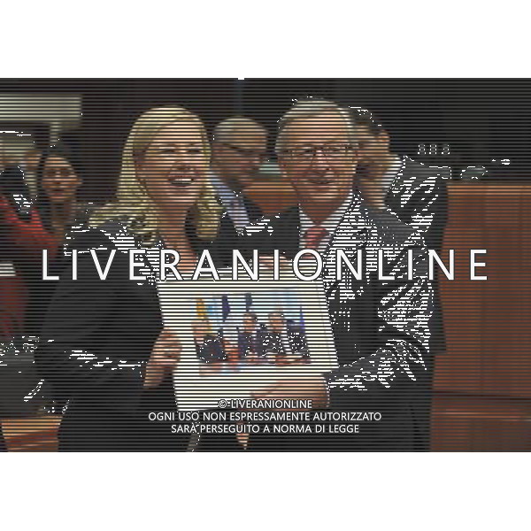 (130121) -- BRUSSELS, Jan. 21, 2013 () -- Finland\'s Finance Minister Jutta Urpilainen (L) offers a photo to Luxembourg\'s Prime Minister and Eurogroup President Jean-Claude Juncker before a Eurogroup financial ministers meeting at the EU headquarters in Brussels, capital of Belgium, Jan. 21, 2013. The new chairman of the Eurogroup to replace outgoing leader Jean-Claude Juncker will be appointed during the meeting, and Dutch Finance Minister Jeroen Dijsselbloem is the only established candidate for the job. (/Ye Pingfan) ©Photoshot/AGENZIA ALDO LIVERANI SAS-ITALY ONLY - EDITORIAL USE ONLY