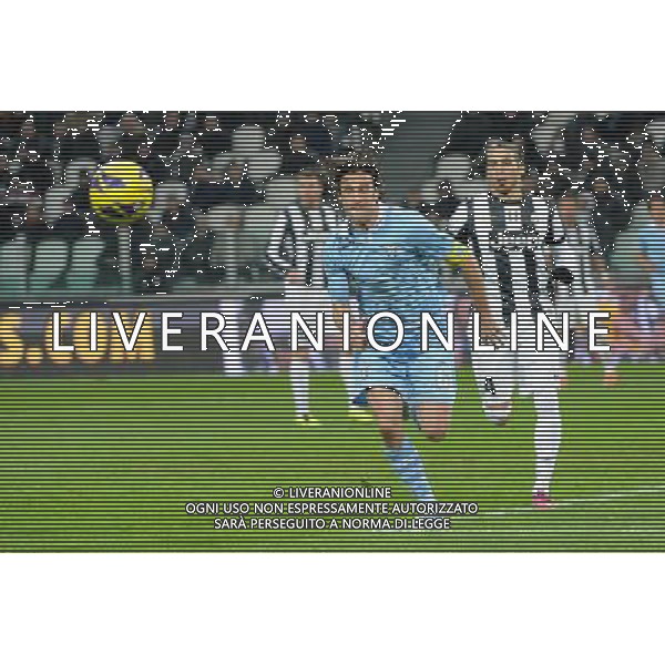 Coppa Italia TIM - Semifinale gara di andata Torino 22-01-2013 Juventus - Lazio nella foto: Stefano Mauri (Lazio) e sulla DX Martin Caceres (Juventus) foto Roberto Garavaglia - ag. Aldo Liverani sas