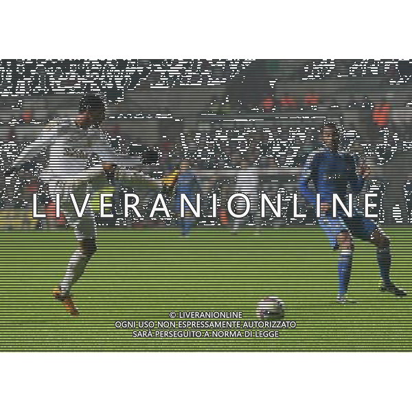 Swansea City\'s Jonathan de Guzman has a shot at goal but mis-kicks - Credit - CameraSport - Ian Cook - Football - Football - Capital One Cup Semi-Final Second Leg - Swansea City v Chelsea - Wednesday 23rd January 2013 - Liberty Stadium - Swansea Â© CameraSport - 43 Linden Ave. Countesthorpe. Leicester. England. LE8 5PG - Tel: +44 (0) 116 277 4147 - admin@camerasport.com - www.camerasport.com