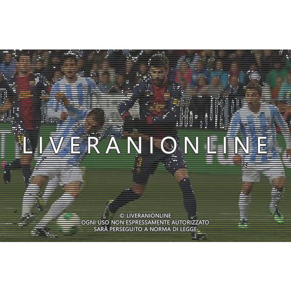 (130125) -- MALAGA, Jan. 25, 2013 () -- Barcelona\'s Gerard Pique (2nd R) vies with Malaga\'s Joaquin Sanchez (3rd R) during their Spanish King\'s Cup quarterfinal second leg soccer match held at Rosaleda stadium in Malaga, Spain, on Jan. 24, 2013. Barcelona won 4-2. (/) ©photoshot/AGENZIA ALDO LIVERANI SAS - ITALY ONLY - MALAGA VS BARCELLONA partita dei quarti di finale della Coppa del re presso Rosaleda stadio a Malaga, in Spagna, 24 gennaio 2013. Il Barcellona ha vinto 4-2. 