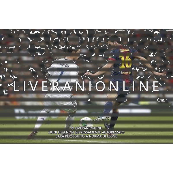 Real Madrid\'s Cristiano Ronaldo and FC Barcelona\'s Sergio Busquets during spanish Kings Cup match on January 30th 2013. Photo: Cid-Fuentes Cebolla / ALFAQUI AG ALDO LIVERANI S A S ONLY ITALY